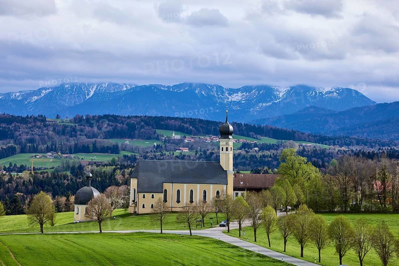 Pilgrimage church Wilparting St. Marinus, mountain landscape, meadow, trees, road, snow-covered mountains, cloudy, nimbostratus clouds, sunlight, light and shadow, Irschenberg, district of Miesbach, Bavaria, Germany, Europe