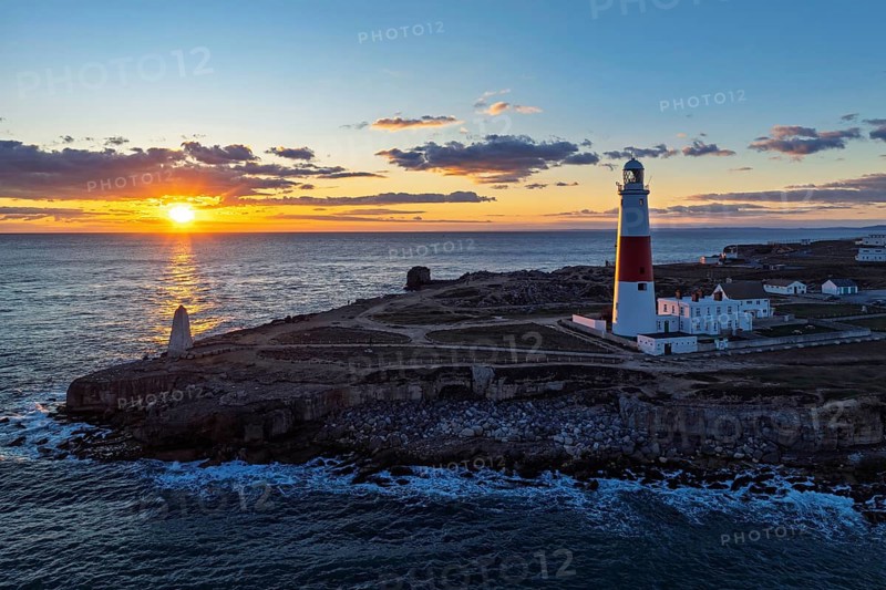 Sunset over Portland Bill Lighthouse from a drone, Portland Bill, Isle of Portland, Dorset, England, United Kingdom, Europe