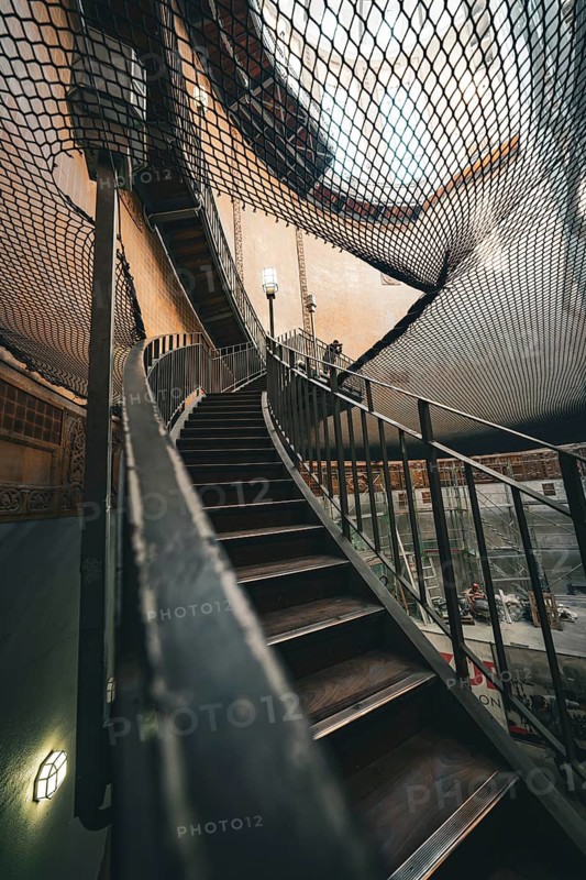 Architectural view of a wooden staircase under a net at a lofty height, old Elbe tunnel, Hamburg, Germany, Europe