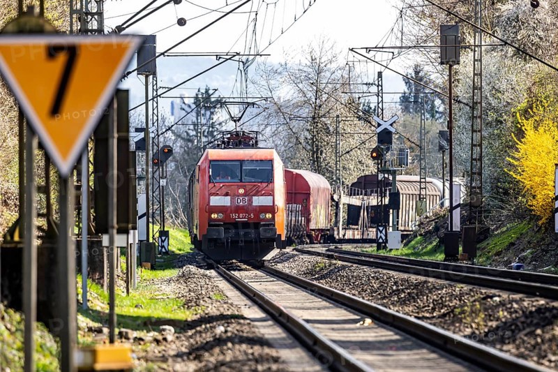 Goods train with a Deutsche Bahn AG locomotive travelling on the open track. Stuttgart, Baden-Württemberg, Germany, Europe