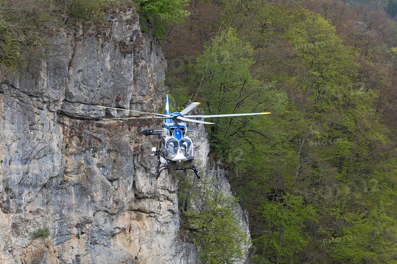 Police rescue operation. Helicopter in action at the slide rock near Bad Urach, Reutlingen district, Swabian Alb on 23/04/2025