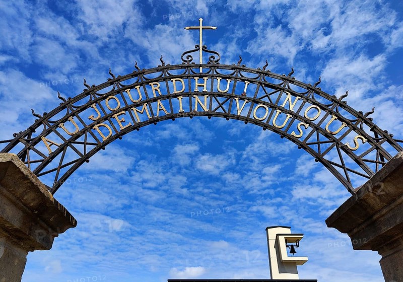 Wrought-iron portal by Francois Theis with the inscription Heute Ihr Morgen Wir, entrance to the cemetery in Consdorf, Duchy of Luxembourg