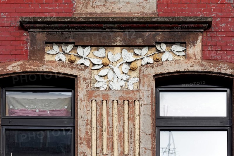 Facade decoration on a Wilhelminian style house for renovation, branches with pears, detail, Duisburg-Neuenkamp, North Rhine-Westphalia, Germany, Europe