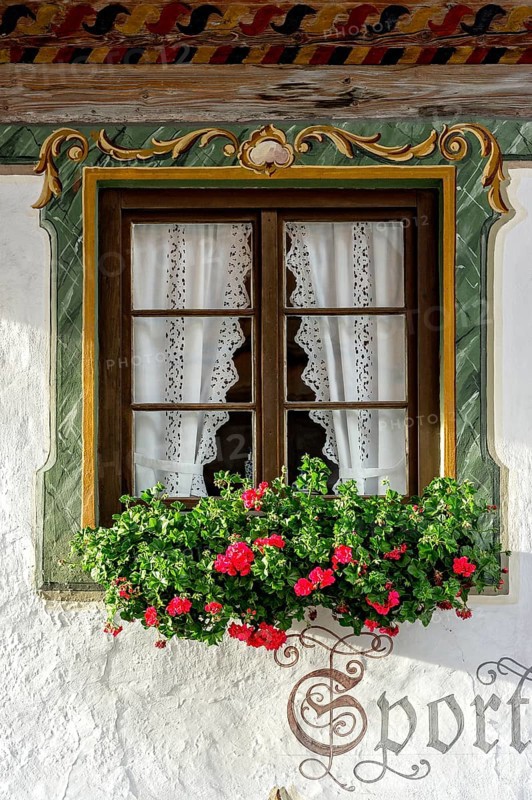 Typical Lüftlmalerei around window with geraniums, Wallgau, Werdenfelser Land, Upper Bavaria, Bavaria, Germany, Europe