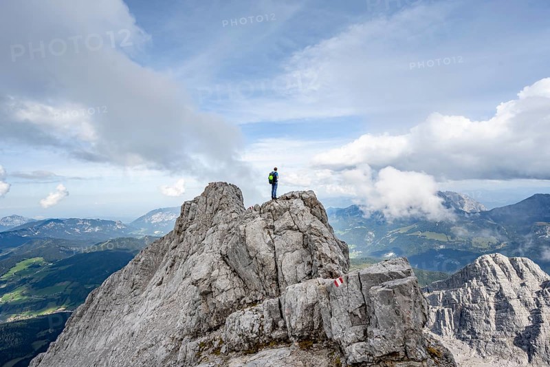 Mountaineer on a narrow rocky ridge, Watzmann crossing to Watzmann Mittelspitze, view of mountain panorama, Berchtesgaden National Park, Berchtesgaden Alps, Bavaria, Germany, Europe