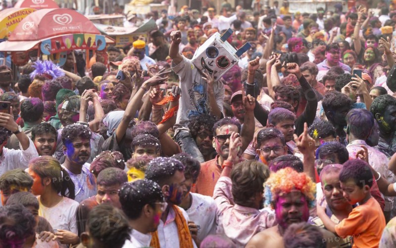 Revellers dancing in the beat of music as they celebrate Holi on a street, the Hindu spring festival of colours on March 25, 2024 in Guwahati, Assam, India. Holi, also known as the Festival of Colors or the Festival of Spring, is one of the most vibrant and joyous festivals in India