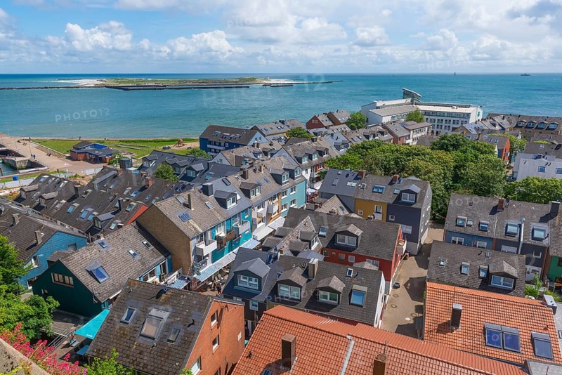 View of the Unterland and the dune from the Oberland Promenade, colourful houses, architecture, roof gables, roofs, trees, horizon, offshore island of Heligoland, North Sea, Pinneberg district, Schleswig-Holstein, Germany, Europe