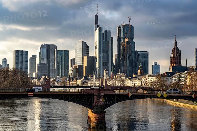 Skyline of the city centre of Frankfurt am Main, river Main, Ignatz-Bubis-Bridge, dusk, Hesse, Germany, Europe