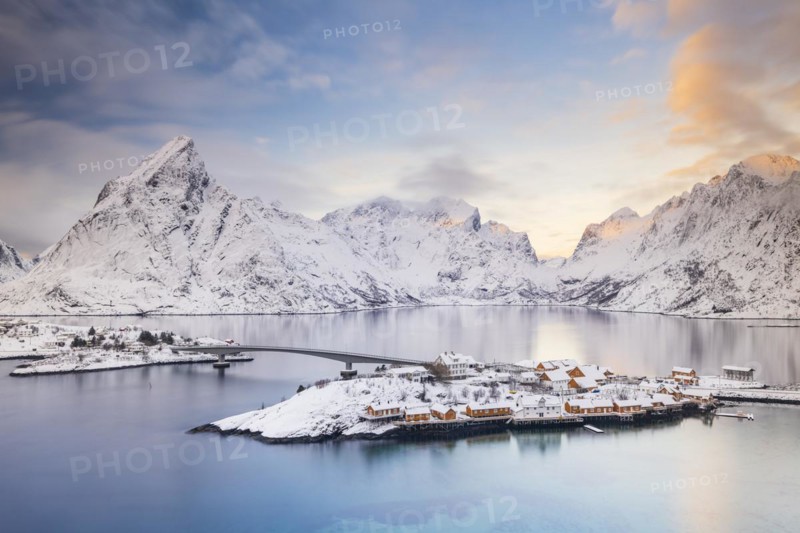 View of snow-covered islands, fjord and mountains, fishing village Sakrisøy, Reine, Reinefjord, Lofoten, Norway, Europe