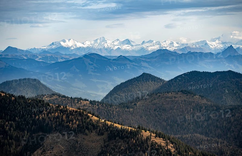 View of the Alpine foothills and main Alpine ridge with snow-covered peaks, summit of the Hohe Tauern with Großvenediger, from the Austrian Schinder, Bavarian Alps, Mangfall mountains, Bavaria, Germany, Europe