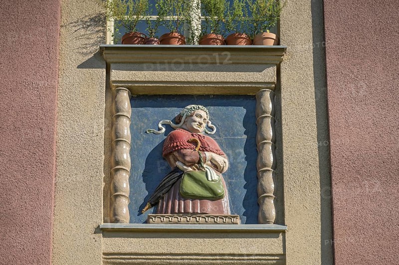 Midwife, relief on old building, former woman's and children's clinic, today St. Marien residential park, Mariendorfer Weg, Neukölln, Berlin, Germany, Europe