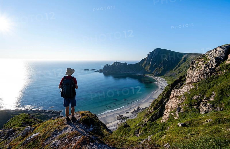 Mountaineer, view of coastal landscape, steep coast with summit Måtind or Måtinden, Høyvika beach and sea, hike to the summit of Måtind, Andøya island, Vesterålen, Nordland, Norway, Europe