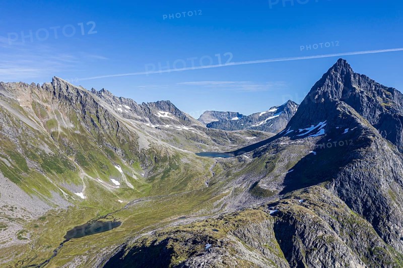 Aerial view of a glacial, u-shaped valley and peak of Mt. Slogen, above village Urke at the Hjørundfjord, Norway, Europe