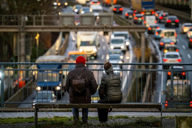 Traffic jam on the A40 motorway, city passage, Essen-Huttrop junction, traffic jam in both directions, 2 people looking at the traffic jam, at the Ruhrschnellweg tunnel, in the city centre, North Rhine-Westphalia, Germany, Europe