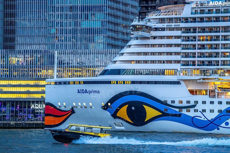 Cruise ship Aida Prima at the Cruise Terminal of Rotterdam, Kop van Zuid, skyscrapers at the Wilhelminakade, water taxi, Netherlands