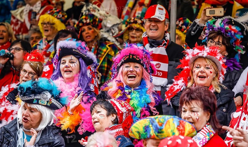 Colourfully costumed carnivalists celebrate carnival in Cologne, on Weiberfastnacht the street carnival is traditionally opened on the Alter Markt, which then reaches its climax on Rosenmontag, Cologne, Rhineland, North Rhine-Westphalia, Germany, Europe
