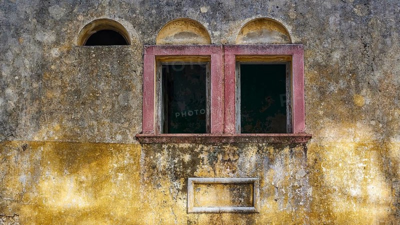Two old windows in a dilapidated, yellow façade with heavily faded and peeling areas, Italian Governor's Palace, Ruins, Italian colonial settlement, Eleousa, Rhodes, Dodecanese, Greek Islands, Greece, Europe