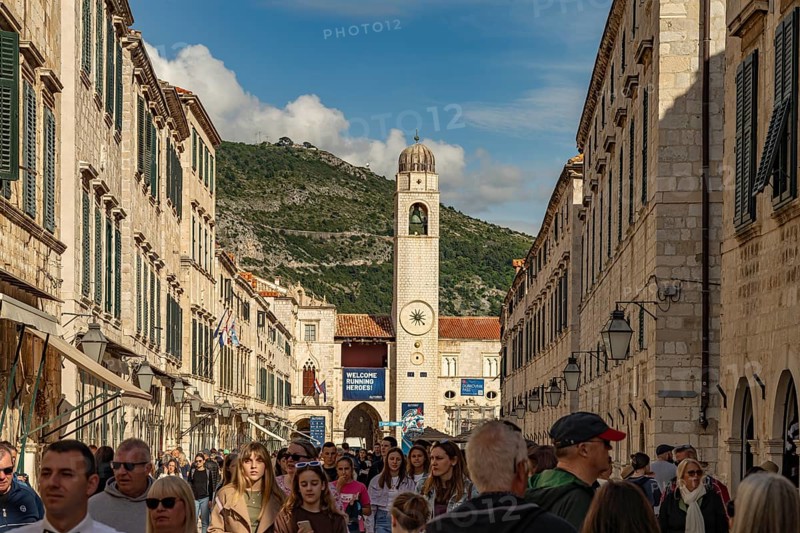 Main promenade Stradun or Placa and the landmark bell tower in Dubrovnik, Croatia, Europe