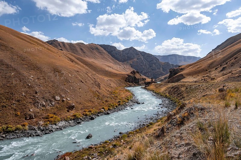 Mountain valley with river between golden meadows, Bolgart Valley, Naryn Province, Kyrgyzstan, Asia