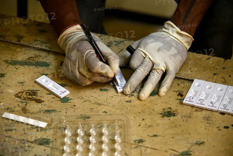A health worker working before Covid-19 Rapid Antigen Testing (RAT), at a Swab collection centre ahead of durga puja festival, in Guwahati, India on 21 October 2020. A cumulative total of 9, 72, 00, 379 samples have been tested up to October 20. According to Johns Hopkins University, which has been compiling COVID-19 data from all over the world, India's death toll is the third-worst