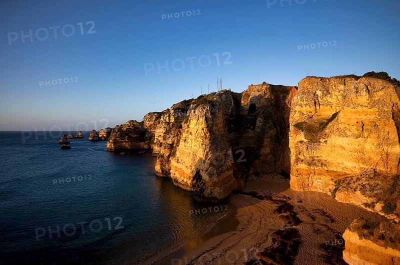 Colourful cliffs and rocks at sunrise on the beach, Praia da Dona Ana, Lagos, cliffs, Atlantic Ocean, Algarve, Portugal, Europe