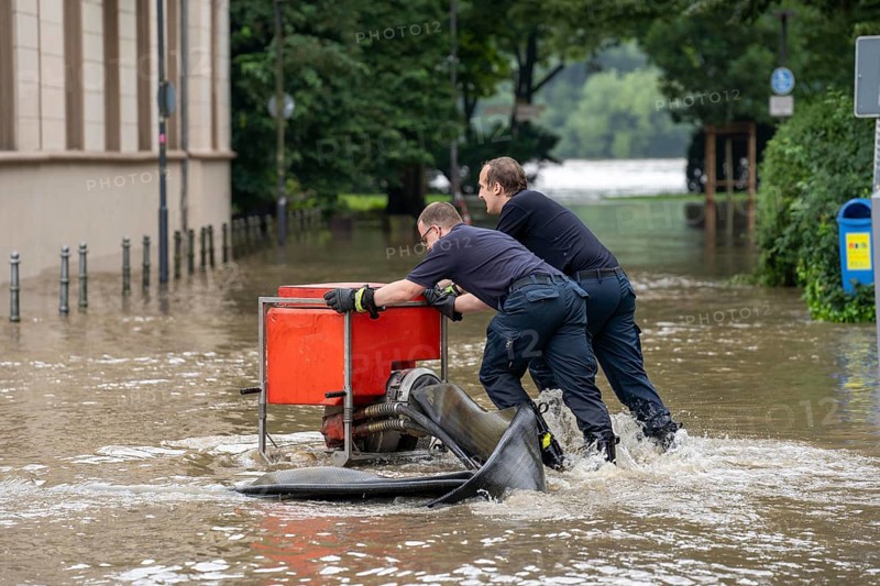 Flood on the Ruhr, after long heavy rainfall the river left its bed and flooded the countryside and villages, the highest water level ever recorded, the fire brigade pumps water out of the streets, Mülheim an der Ruhr, North Rhine-Westphalia, Germany, Europe