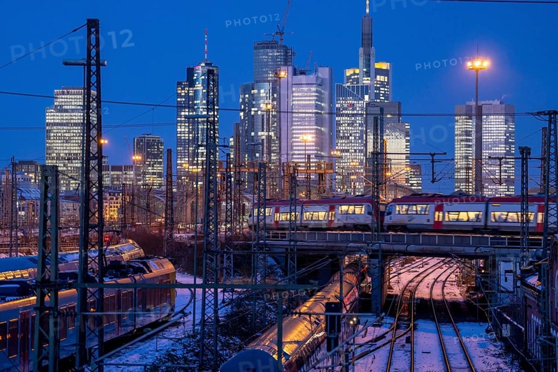 Railway tracks in front of the main railway station in Frankfurt am Main, skyline of skyscrapers in the Cit, winter, snow, dusk, Hesse, North Rhine-Westphalia
