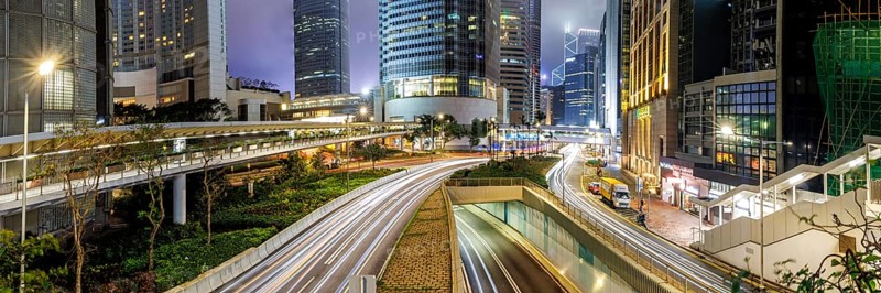 Traffic with streets and skyscrapers in the city of Hong Kong at night Panorama in Hong Kong, China, Asia