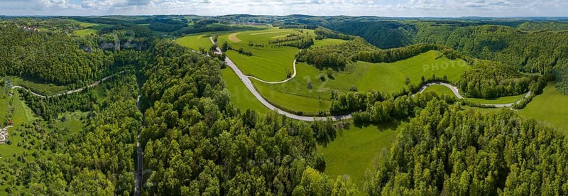 Winding country road through a forest, Swabian Alb in spring, panoramic photo, drone photo, Gutenberg, Lenningen, Baden-Württemberg, Germany, Europe