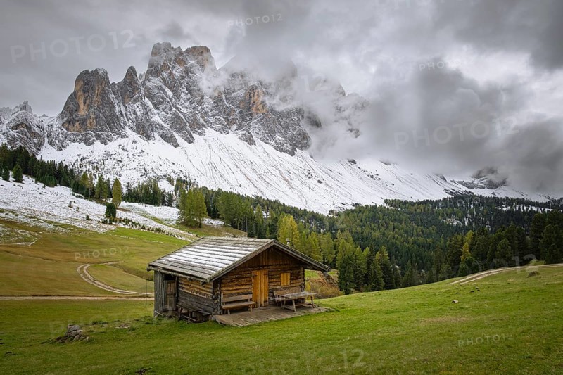View of a part of the Geisler group from the Gampenwiese, in the foreground an alpine hut, Dolomites, snow, Puez-Geisler nature park Park, St. Magdalena, Funes, Villnößtal, South Tyrol, Italy, Europe
