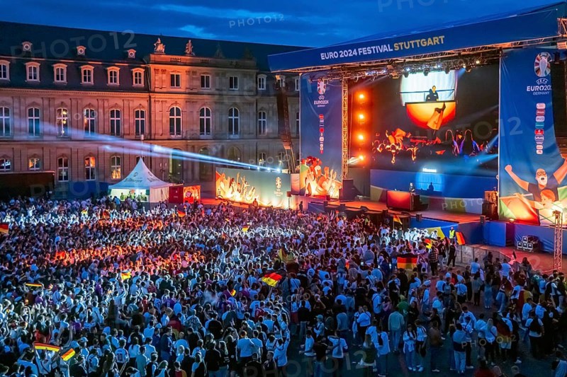 Public viewing at Neues Schloss in Stuttgart in the evening. 30, 000 people celebrate the German national football team during the European Championship on the fan mile on Schlossplatz. Motto for UEFA EURO 2024: The whole city one stadium. Stuttgart, Baden-Württemberg, Germany, Europe