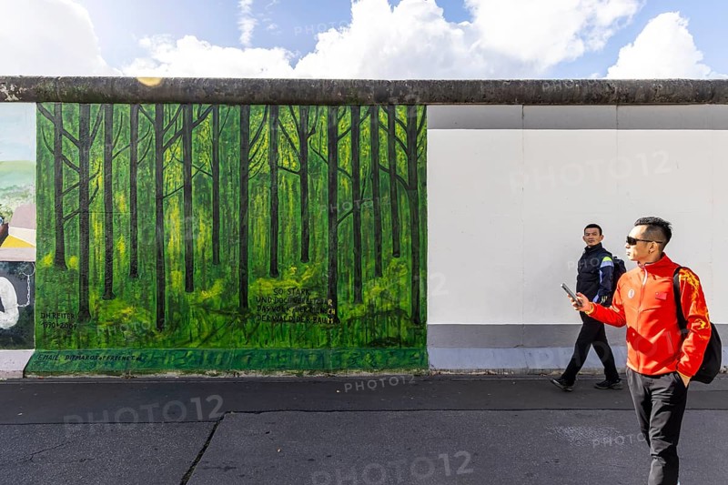 East Side Gallery. Remnant of the Berlin Wall, designed by artists. Landmark and city view Berlin, Germany, Europe