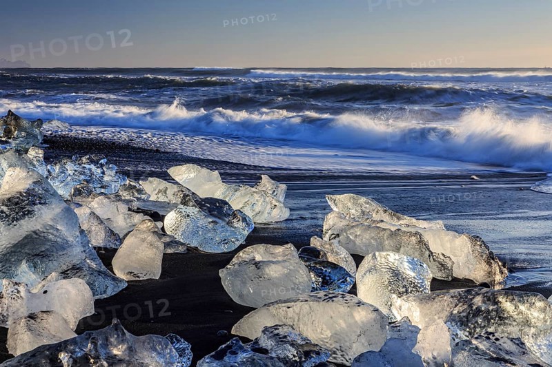 Ice floes on the beach, waves, sea, sunny, morning light, winter, Diamond Beach, Breidamerkursandur, Jökulsarlon, Iceland, Europe
