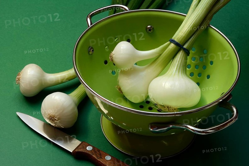 Onion, spring onions in sieve pot