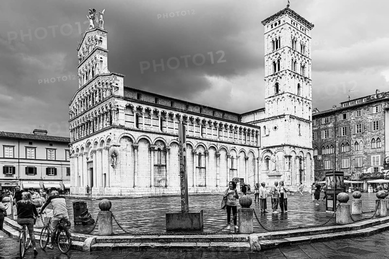 Dark rain clouds over the bell tower of the church of San Michele in Foro, and Piazza San Michele, historic city centre, black and white photo, Lucca, Tuscany, Italy, Europe