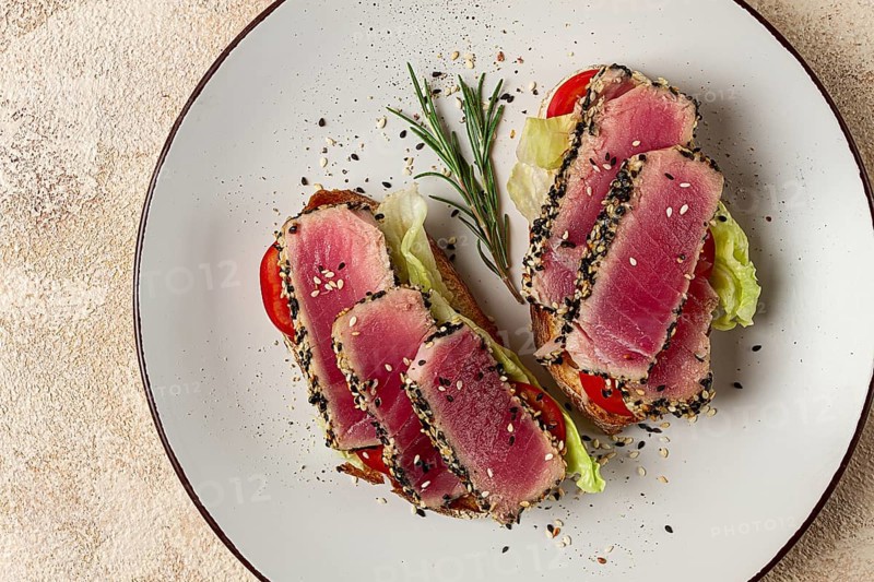Sandwiches with fried tuna fillet, sesame, breakfast, top view, homemade
