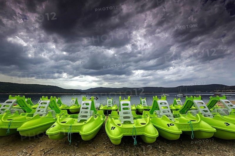 Pedal boats on the beach in Sainte Croix du Verdon, Lac de Sainte-Croix, thunderstorm atmosphere, Provence-Alpes-Côte d'Azur, Provence, France, Europe