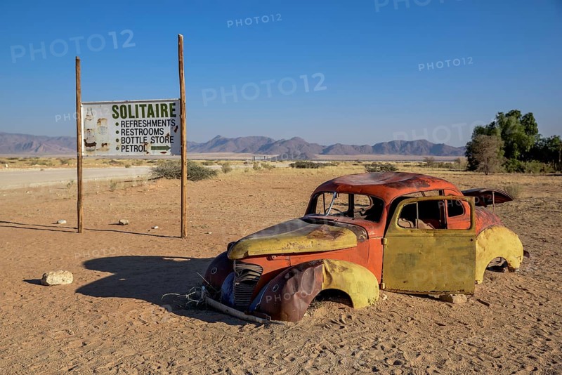 Rusty car wreck in sand, Solitaire, Hardap Region, Namibia, Africa