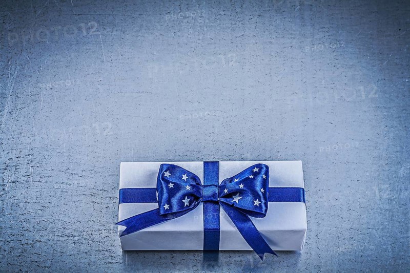 Packed box-container on metallic background celebrations concept