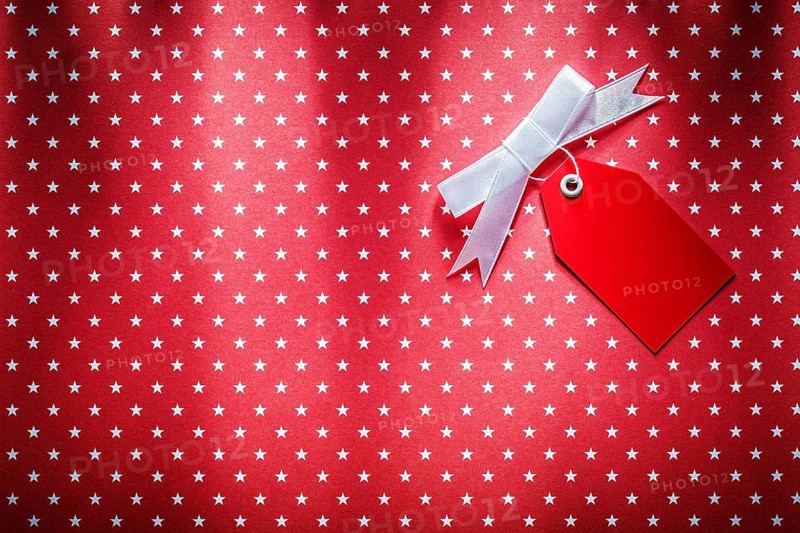 Sale tag on red fabric shopping concept