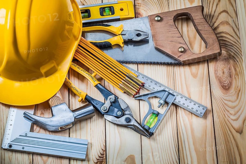 Tools and helmet on wooden boards