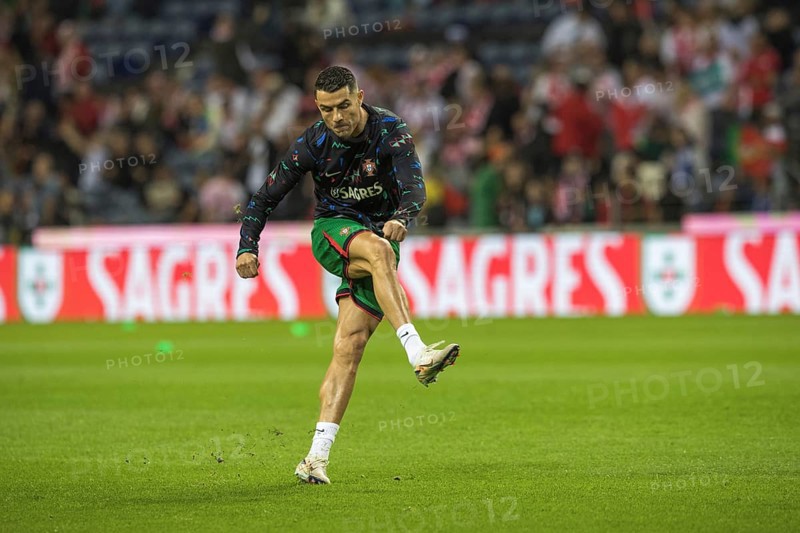 Football match, Cristiano RONALDO CR7 Portugal warming up in front of the match with left foot shot and closed eyes the ball is not visible, Estadio do Dragao, Porto, Portugal, Europe