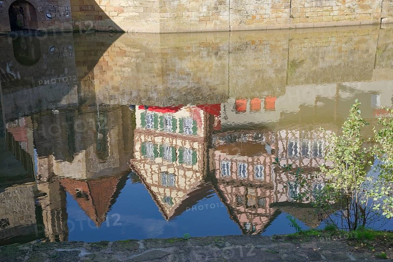 Reflection of half-timbered houses and St John's Church, Kocher Valley, Kocher, Schwäbisch Hall, Hohenlohe, Heilbronn-Franken, Baden-Württemberg, Germany, Europe
