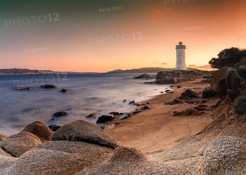 Long exposure view of the Punta Palau Lighthouse on the Emerald Coast of Sardinia at sunrise