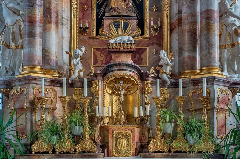 Main altar with candles and tabernacle, St George and Florian is a listed Catholic parish church in Reicholzried, Allgäu, Bavaria, Germany, Europe