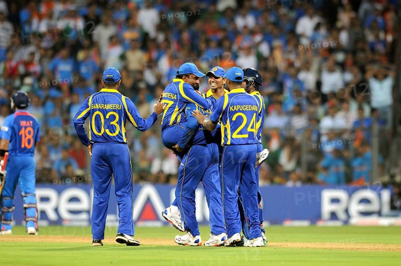 Sri Lankan player 2L Mahela Jaywerdena leaps wicket batsman Virat Kohli L ICC Cricket World Cup Wankhede Stadium Mumbai