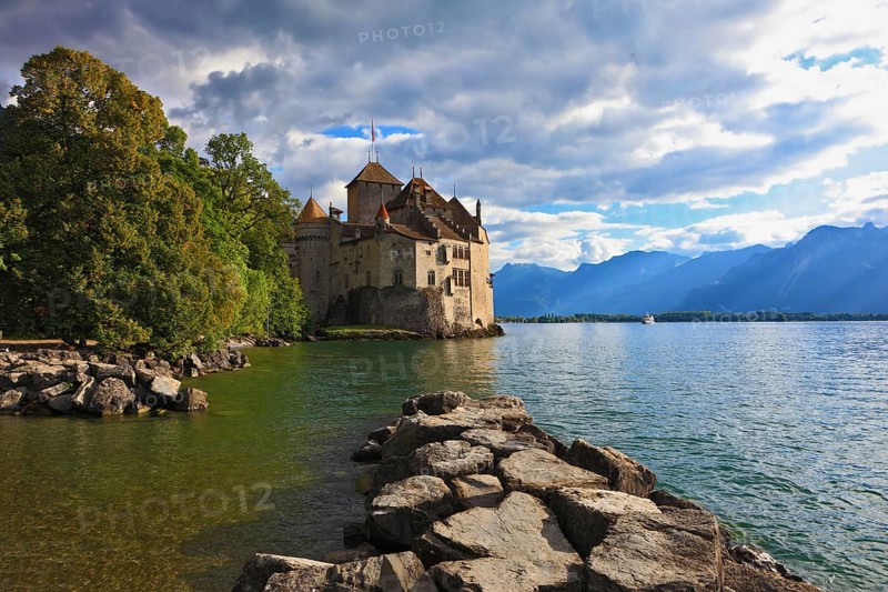 Lake in the mountains. Cold sunset Lake Geneva in the fall on sunny day. Montreux, Switzerland, Europe