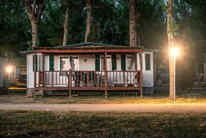 Wooden bungalow in camping at night
