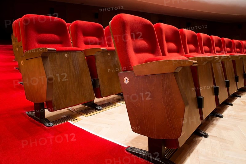Red seats in a theater and opera