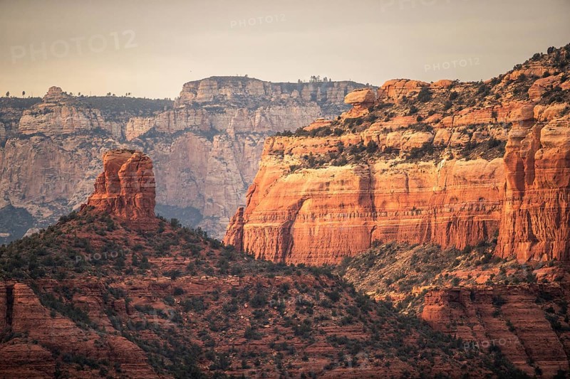 Majestic red rock formations and cliffs in a desert landscape under a clear sky in Sedona, Arizona, USA, North America